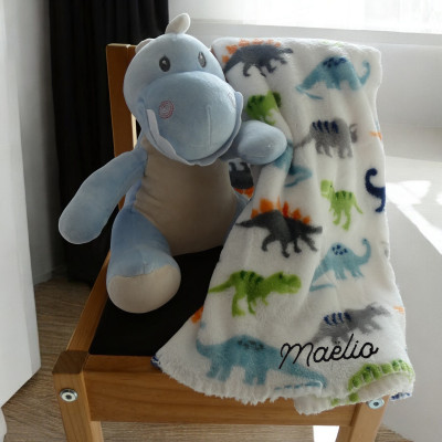 peluche dinausore bleu et son plaid
